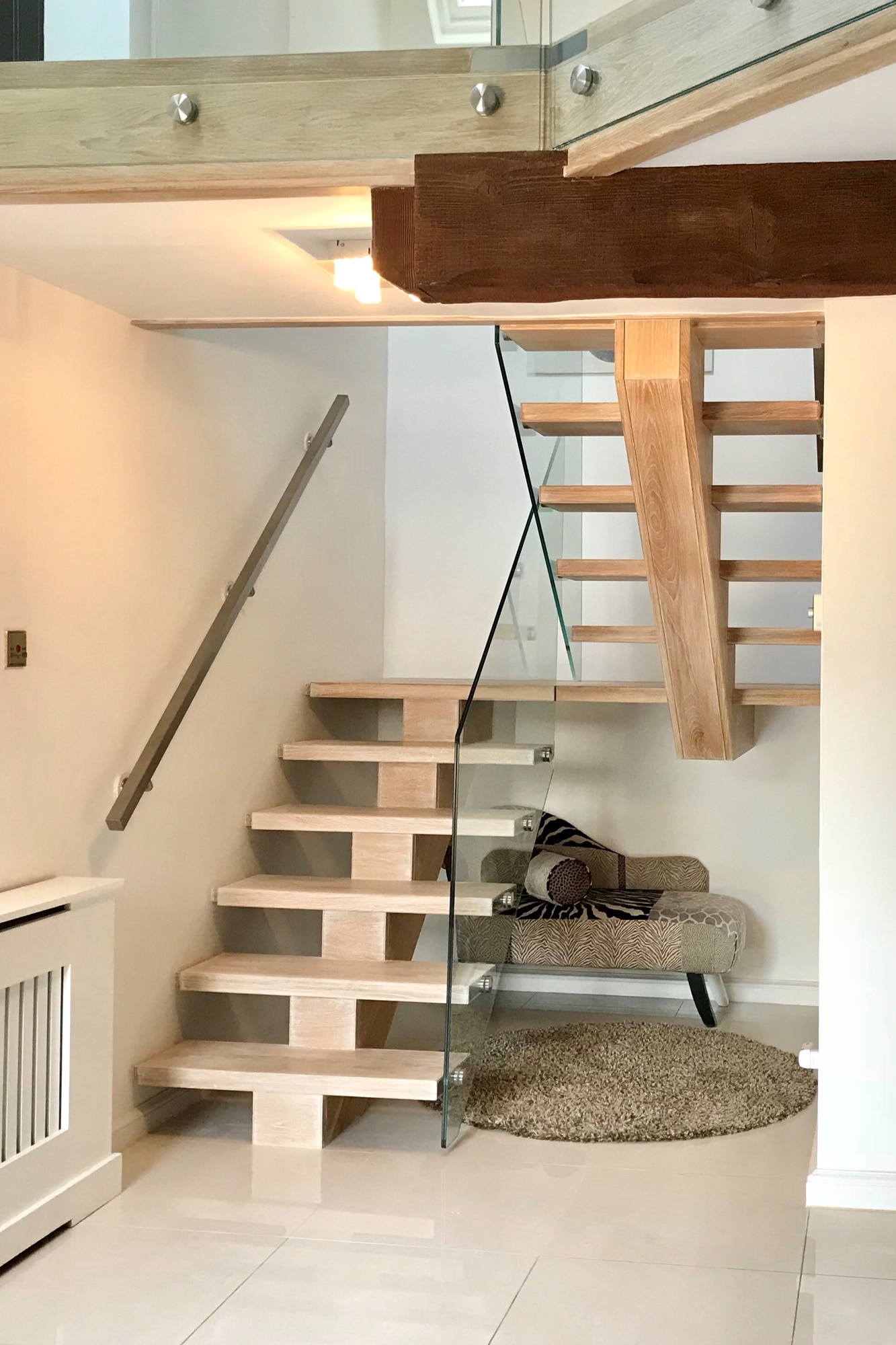 Single spine staircase with glass in Beaconsfield Buckinghamshire
